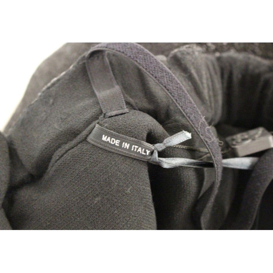 جمبسوت أنيق من الجلد الأسود مع حزام خصر من La Maison du Couturier