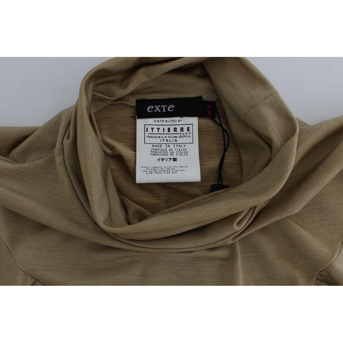 بلوزة إكستي غلاموروس ذهبية اللون برقبة عالية