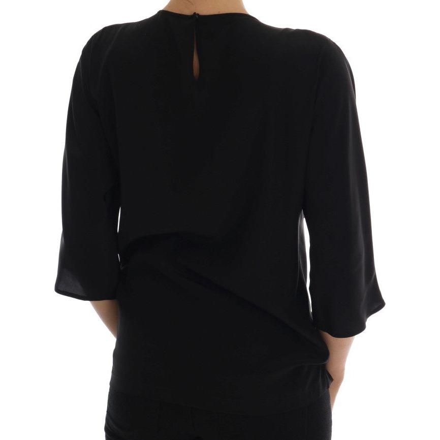 بلوزة من الحرير المطرزة برسومات خيالية من دولتشي آند غابانا